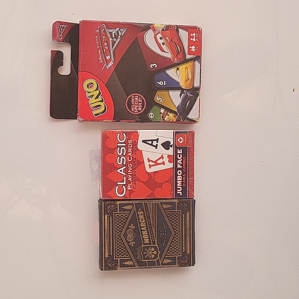 Bundle of playing cards. And a deck of Uno cards - Cars edition.